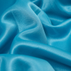 Sky Blue Luminous Fashion-Weight Neoprene - Detail | Mood Fabrics