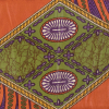 Orange, Purple and Green Waxed Cotton African Print with additional Inlaid Pattern - Folded | Mood Fabrics