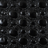 Black Faux Patent Leather Circular Quilted Coating - Detail | Mood Fabrics