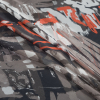 Taupe and Orange Abstract Printed Silk Chiffon - Folded | Mood Fabrics