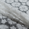 White Floral Stretch Crochet Lace - Folded | Mood Fabrics