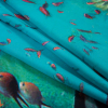 Oceanic Blue Organic Viscose Batiste with a Coral Reef Border Print - Folded | Mood Fabrics