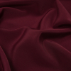Dark Burgundy Polyester Peachskin - Detail | Mood Fabrics