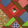 Green and Orange Geometric Waxed Cotton African Print - Folded | Mood Fabrics