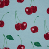 Cherries Printed on a Blue Cotton Jersey - Detail | Mood Fabrics