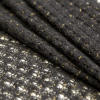Black and Metallic Gold Blended Wool Crochet Lace - Folded | Mood Fabrics