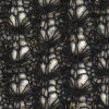 Black and Metallic Gold Blended Wool Crochet Lace - Detail | Mood Fabrics