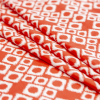 Bright Red and White Geometric Ikat Stretch Polyester Jacquard - Folded | Mood Fabrics