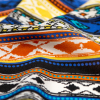 Blue, Orange and Yellow Tribal Printed Silk Crepe de Chine - Detail | Mood Fabrics