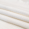 White Quilted Rayon Knit with Filler and Polyester Knit Backing - Folded | Mood Fabrics