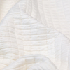 White Quilted Rayon Knit with Filler and Polyester Knit Backing - Detail | Mood Fabrics