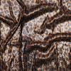 Gold and Black Cheetah Stretch Circle Sequins | Mood Fabrics