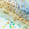 Parasailing Blue and Green Confetti Silk Chiffon - Folded | Mood Fabrics