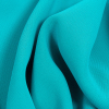 Premium Suzie Turquoise Polyester 4-Ply Crepe - Detail | Mood Fabrics