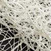 Luxury Off-White Thin Webbed Guipure Lace with Silver Glitter Topcoat - Folded | Mood Fabrics