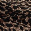 Brown Leopard Printed Stretch Cotton Denim - Folded | Mood Fabrics