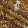 Famous Australian Designer Golden Paisley Printed Stretch Polyester Jersey - Folded | Mood Fabrics