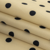 Italian Cream and Navy Polka Dots Rayon Twill - Folded | Mood Fabrics