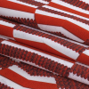 Aurura Red and Burgundy Geometric Caye UV Protective Compression Swimwear Tricot with Aloe Vera Microcapsules - Folded | Mood Fabrics