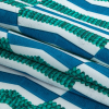 Blue and Teal Geometric Caye UV Protective Compression Swimwear Tricot with Aloe Vera Microcapsules - Folded | Mood Fabrics