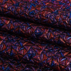 Mood Exclusive Metallic Royal Blue and Red Tactile Triangles Luxury Brocade - Folded | Mood Fabrics