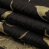 Metallic Gold and Black Floral Border Print Luxury Brocade - Folded | Mood Fabrics