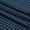 Deep Blue and White Checkered Stretch Cotton Jersey - Folded | Mood Fabrics