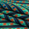 Jade, Blue and Orange Art Deco Feathers UV Protective Compression Swimwear Tricot with Aloe Vera Microcapsules - Folded | Mood Fabrics