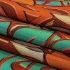 Orange and Turquoise Art Nouveau Leaves UV Protective Compression Swimwear Tricot with Aloe Vera Microcapsules - Folded | Mood Fabrics