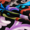 Mood Exclusive Italian Black and Rainbow Ornate Swirls Silk Charmeuse - Folded | Mood Fabrics