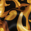 Mood Exclusive Italian Black and Gold Ornate Swirls Silk Charmeuse - Detail | Mood Fabrics