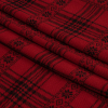 Red and Black Snowflake Plaid Brushed Stretch Polyester Sweater Knit - Folded | Mood Fabrics
