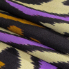 Italian Black, Purple and Orange Ikat Spots Silk Charmeuse - Folded | Mood Fabrics
