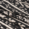 Mood Exclusive Black Sun Carvings Sustainable Viscose and Polyester Twill - Folded | Mood Fabrics