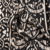 Mood Exclusive Black Sun Carvings Sustainable Viscose and Polyester Twill | Mood Fabrics