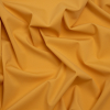 Famous Australian Designer Mustard Stretch Polyamide Interlock Knit | Mood Fabrics
