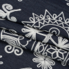 Indigo and White Elephants and Flowers Chainstitch Embroidered Lightweight Cotton Denim - Folded | Mood Fabrics