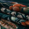 British Imported River Tropical Fruits and Foliage Printed Polyester Microvelvet - Folded | Mood Fabrics