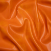 Alida Tangerine Faux Upholstery Leather with Brushed Fabric Backing | Mood Fabrics
