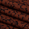 Mood Exclusive Poppy Paradise Rust Stretch Polyester Crepe - Folded | Mood Fabrics