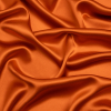 Premium Burnt Orange Silk Crepe Back Satin | Mood Fabrics