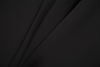 Black Polyester Neoprene - Folded | Mood Fabrics
